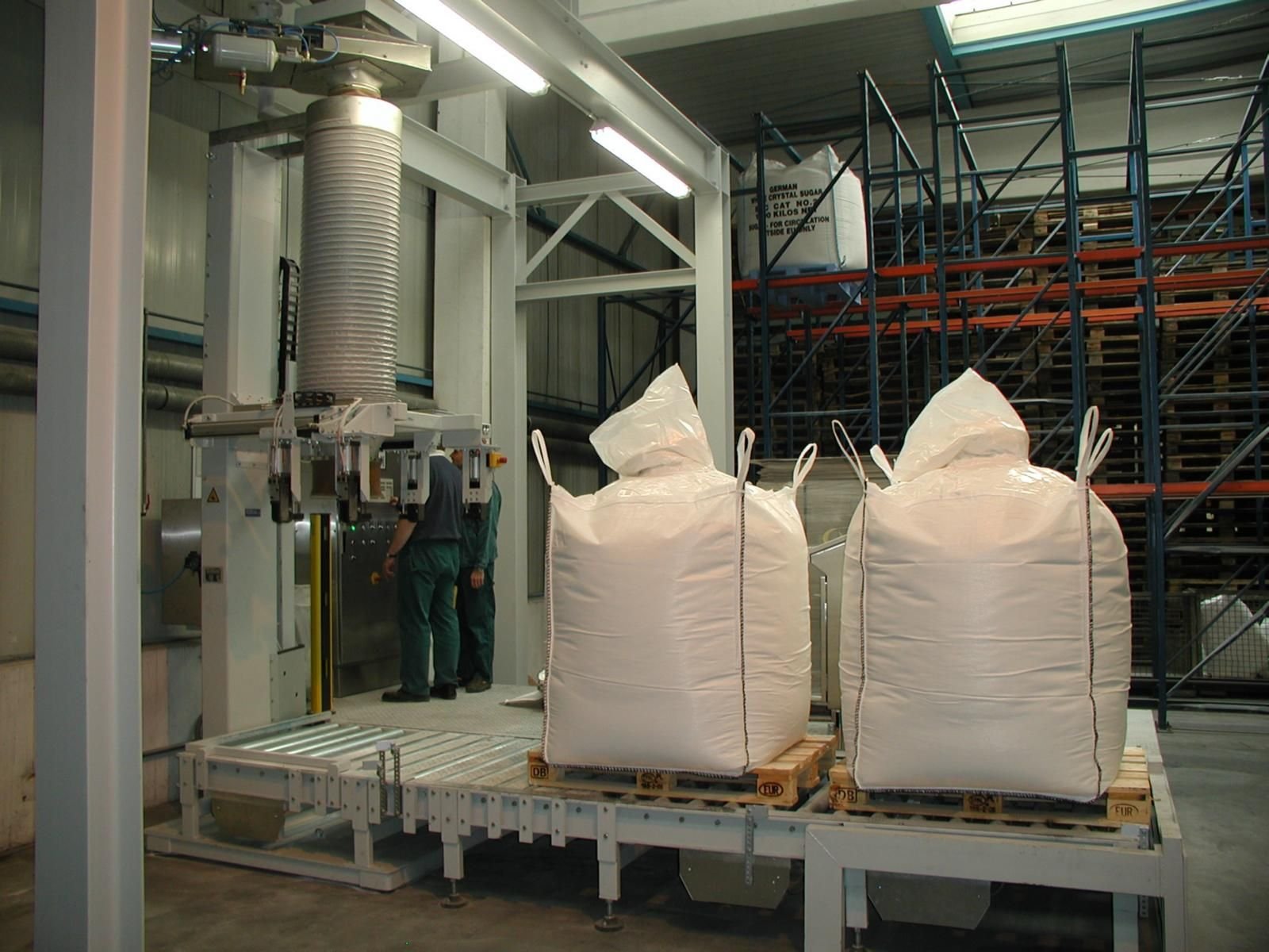 White 1.2-ton jumbo FIBC bags stacked in a warehouse ready for container loading